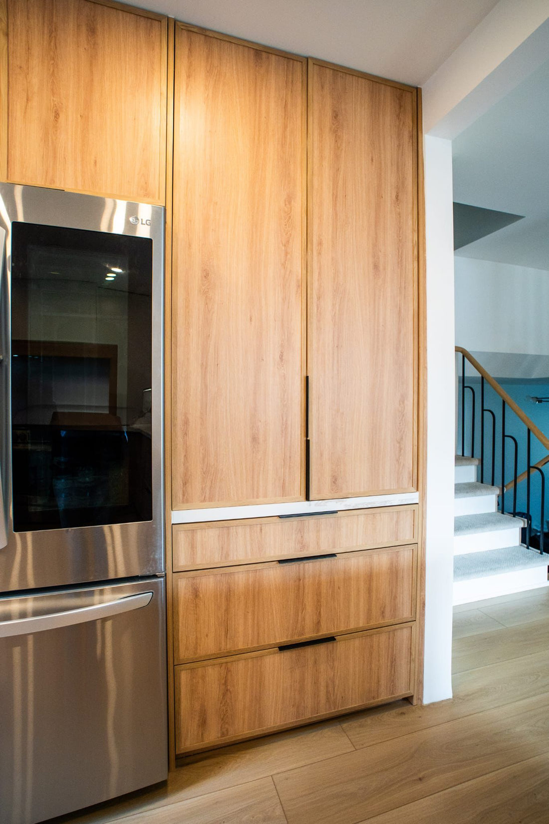 Completed kitchen cabinetry used to illustrate consistent cabinet handle and pull placement