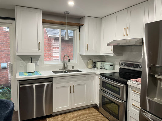 Finished Ontario kitchen showing wall space that can be planned with upper cabinets or open shelving